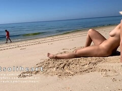 Naughty amateur wife enjoys sunbathing naked on a crowded public beach