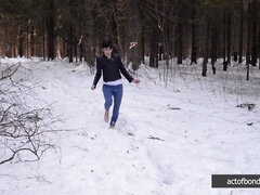 Barefoot Claudia is captured in the cold winter forest