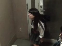 Lascivious Japanese schoolgirl urinating in a public building