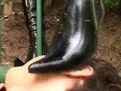 Exhibitionist femdom kicking & pussy dominate slave outdoor through the fence