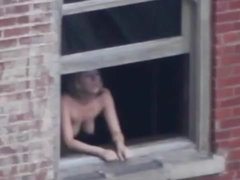 Lusty chick has a thing for getting ravaged at the window, in the middle of the day