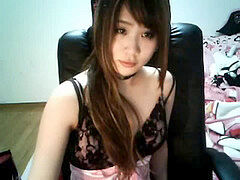 fantastic chinese web cam girl attempting to pierce her own nipple