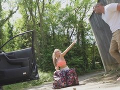 Strong dude gives a sweet blonde a helping dick outdoors