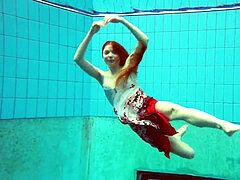 steaming polish red-haired swimming in the pool